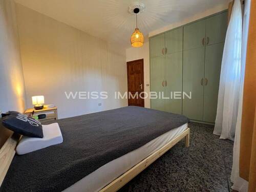Schlafzimmer mit Einbauschrankwand - 