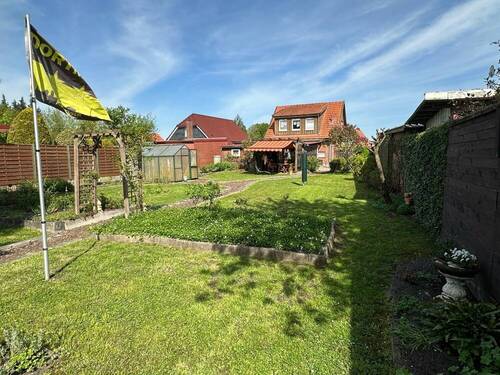 Gartenansicht - Mehrfamilienhaus, Wohnhaus mit 106,80 m² in Rhauderfehn zum Kaufen