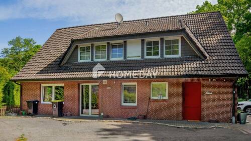 Außenansicht 4 - Großzügiges MFH mit Gartenidylle, drei Wohneinheiten und solider Mieteinnahme - in ruhiger Lage