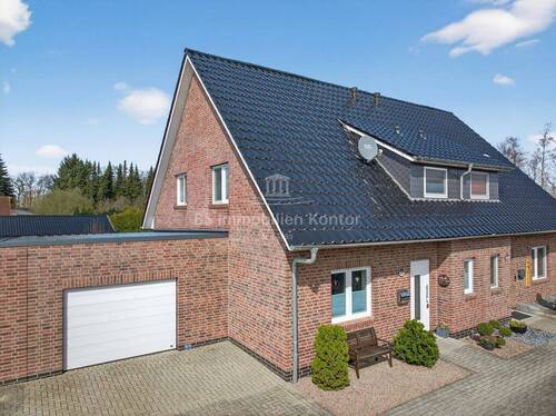 Bild 1 - Top gepfl. DHH mit Erdwärme, Garage, Terrasse und lichtdurchfl. Räumlichkeiten in Papenburg