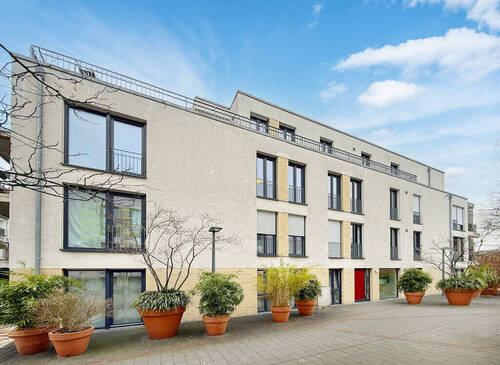 Frontansicht - Vermietete 4-Zimmer-Wohnung mit Balkon und zwei Tiefgaragenstellplätzen