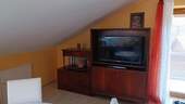 Wohnbereich mit TV - 3 Zimmer Etagenwohnung in Wertach
