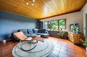 Wohnzimmer im Untergeschoss - Einfamilienhaus mit 241,10 m&sup2; in Sinsheim zum Kaufen