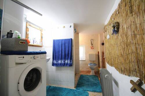 Badezimmer mit Waschmaschinenanschluss - 