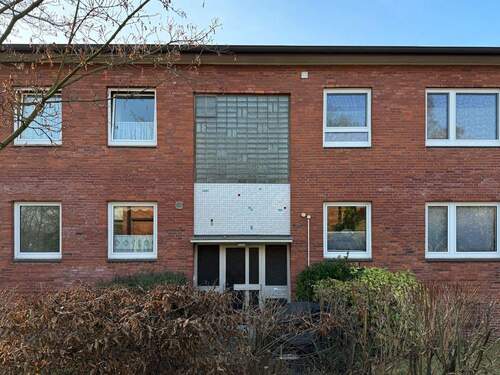 Ansicht Haus - Großzügige 3 bis 4-Zimmer-Wohnung mit Terrasse und Einzelgarage in guter Lage