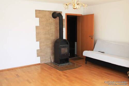 Wohnzimmer mit Kaminofen - 