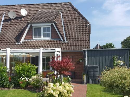 Rückansicht mit Wintergarten - 4 Zimmer Doppelhaushälfte in Albersdorf