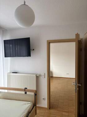 Schlafzimmer mit Zugang zum Balkon - 