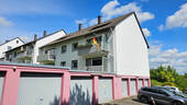 Rückansicht mit Garagen - Etagenwohnung mit 74,00 m&sup2; in Odenthal / Glöbusch zum Kaufen