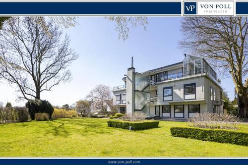 Titelbild - Urbanes Wohnen mit Naturflair: Lichtdurchflutete Terrassenwohnung mit Pool und Sauna