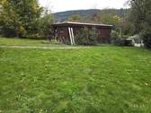 Doppelgarage mit Holzplatz - 