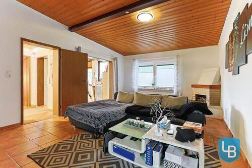 Wohnbereich mit Kamin - 5 Zimmer Doppelhaushälfte in Ascheberg