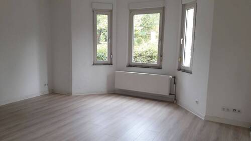 Wohnzimmer WE Erdgeschoss - Mehrfamilienhaus, Wohnhaus mit 275,00 m² in Bünde zum Kaufen