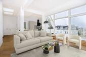 Wohnzimmer Möblierungsbeispiel - Urbaner Lifestyle über den Dächern - exklusiver Erstbezug mit Terrasse