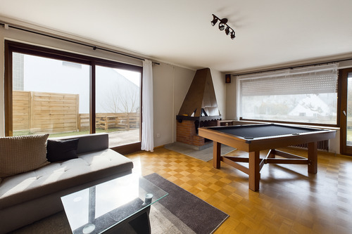 Wohnzimmer mit Zugang zur Terrasse - 