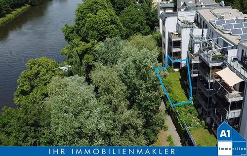Außenansicht mit Markierung und Logo - Exklusive Erdgeschoss- Eigentumswohnung mit Garten, zwei Stellplätzen , zwei Abstellräumen und hochwertiger Ausstattung mit Blick auf die Saale