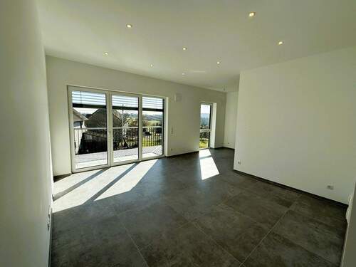 Wohnzimmer - Exklusives Wohnen im Erstbezug: 104,6 m² Neubau-Dreizimmerwohnung mit Aufzug, Balkon und Stellplatz