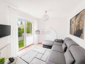 Wohnzimmer - Mehrfamilienhaus, Wohnhaus mit 142,00 m&sup2; in Bad Pyrmont zum Kaufen