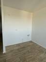 Musterbild Wohnzimmer mit integrierter Küchenzeile - 