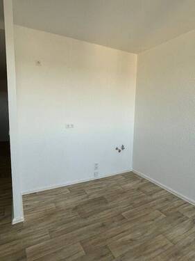 Musterbild Wohnzimmer mit integrierter Küchenzeile - 
