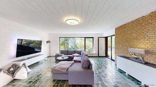 Großzügiges Wohnzimmer mit Zugang zu Terrasse und - Bungalow mit 148,30 m² in Hamm zum Kaufen