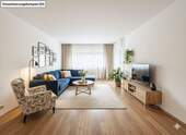 Wohnzimmer - Urbanes Wohnglück im Grünen - Moderne 2-Zimmer-Erdgeschoßwohnung in Bestlage