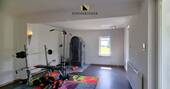 ehemaliges Wohnzimmer mit Holzofen - 