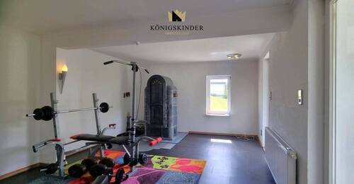 ehemaliges Wohnzimmer mit Holzofen - 