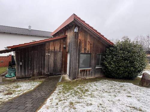 Gemütliches Holzhaus mit durchdachter Raumaufteilung und großem Gartenbereich - 