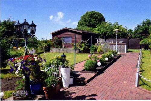 Angelegter Garten.jpg - 4 Zimmer Mehrfamilienhaus, Wohnhaus zum Kaufen in Kiel