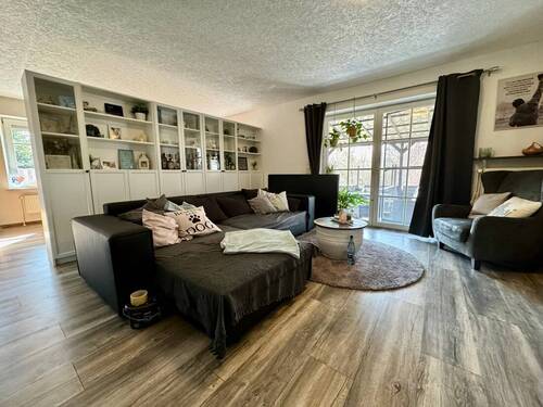 Wohnzimmer Wohnung 1 - Mehrfamilienhaus, Wohnhaus mit 240,00 m&sup2; in Garding zum Kaufen