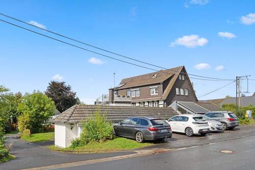 Parkplätze Außenanlagen - Mehrfamilienhaus, Wohnhaus mit 445,00 m&sup2; in Lohmar zum Kaufen