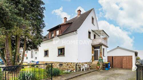 Außenansicht 1 - Einfamilienhaus mit großem Garten in Schwalbach