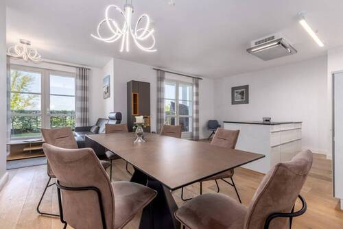 Das Wohnzimmer mit moderner NOLTE-Küche - 3 Zimmer Etagenwohnung in Sellin