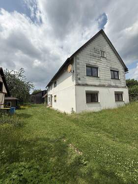 Bild 1 - Sanierungsbedürftiges Mehrfamilienhaus in 37441 Bad Sachsa OT Tettenborn