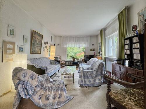 Wohnzimmer mit Gartenausrichtung - Einfamilienhaus mit 140,00 m² in Berlin zum Kaufen