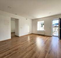 Moderne 2-Zimmer Erdgeschosswohnung mit Terrasse in Damflos zu vermieten