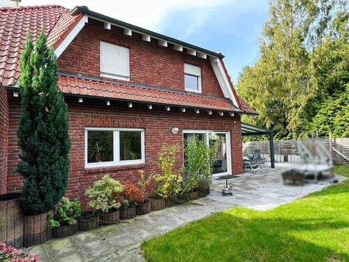 Gartenansicht mit großer Terrasse - 5 Zimmer Einfamilienhaus zum Kaufen in Greven