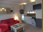 Wohnbereich mit Küche - 1 Zimmer Etagenwohnung in Friedrichskoog