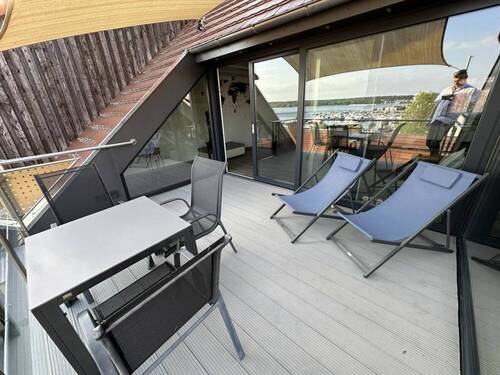 Loggia im Sommer - Mehrfamilienhaus, Wohnhaus mit 126,00 m&sup2; in Waren (Müritz) zum Kaufen