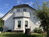 Giebelansicht Balkon - Einfamilienhaus mit 140,00 m² in Stockum-Püschen zum Kaufen