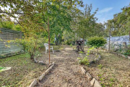 Garten mit Kinderspielplatz und Sitzecke - Einfamilienhaus mit 91,00 m² in Bruchsal zum Kaufen