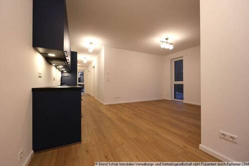 09 Wohnzimmer mit offener Küche - 