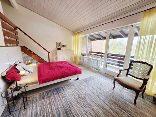 Schlafzimmer mit Zugang zum Balkon - 