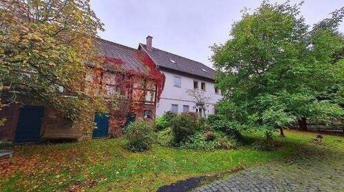 Bild 1 - 8 Zimmer Mehrfamilienhaus, Wohnhaus zum Kaufen in Heinade