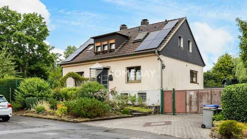 Außenansicht 1 - Einfamilienhaus mit Einliegerwohnung, großem Grundstück und vielseitigen Nutzungsmöglichkeiten