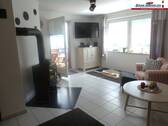 Wohnbereich mit Kamin - 4 Zimmer Etagenwohnung in Fehmarn OT Wenkendorf