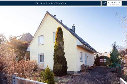 Portale - Familienglück auf zwei Ebenen: Haus mit Garten und Kamin