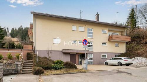 Außenansicht 1 - Möblierte 1,5-Zimmer-Wohnung mit Balkon und Tiefgaragenstellplatz in ruhiger Waldrandlage