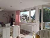 Wohnzimmer mit Balkon im DG - 